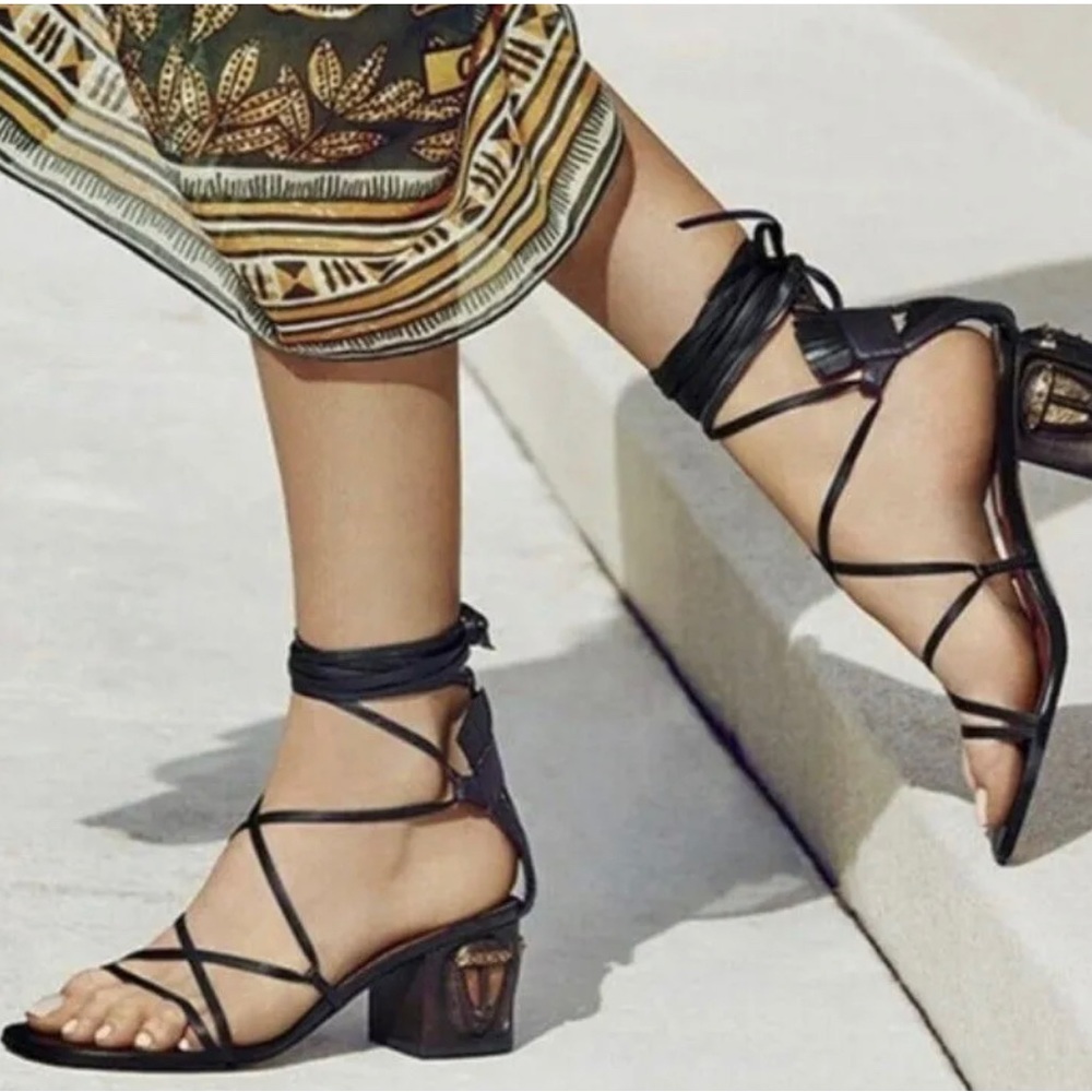 Valentino Garavani tribe mask sandals.